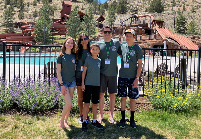 Korolyk family in front of water slides at flok Family Camp West